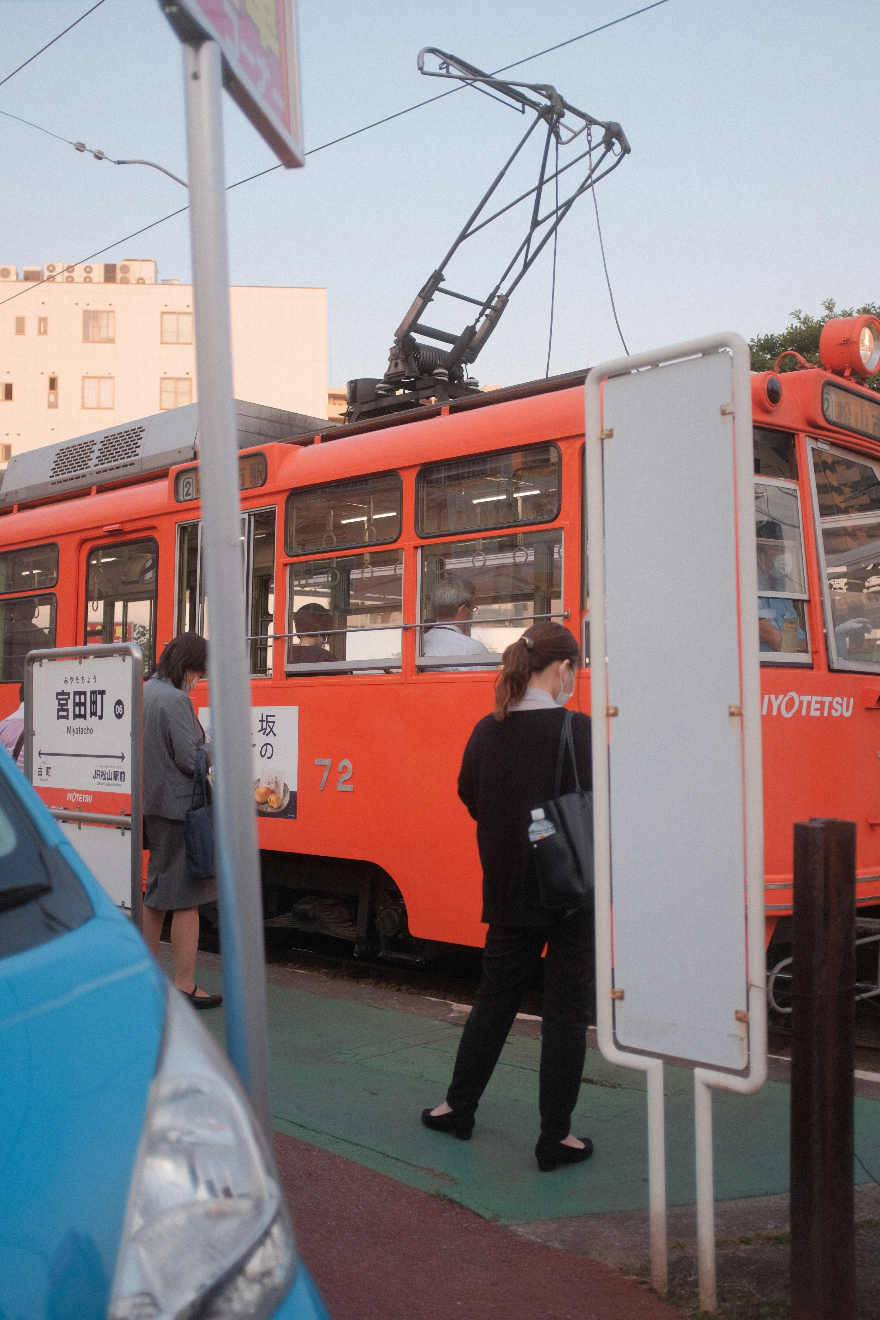 red and white tram on road during daytime